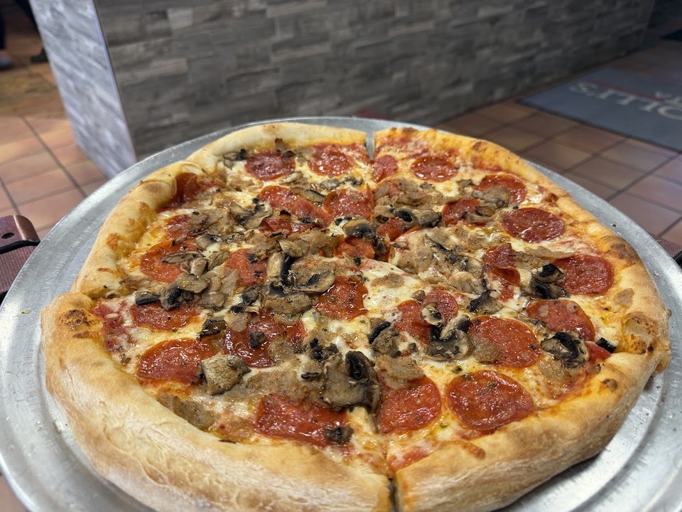 Pizza and Italian dishes on display.