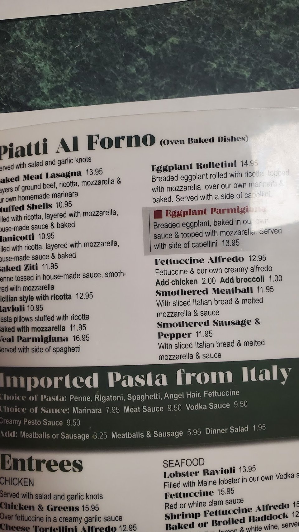 Close-up of Italian sub and pizza choices.